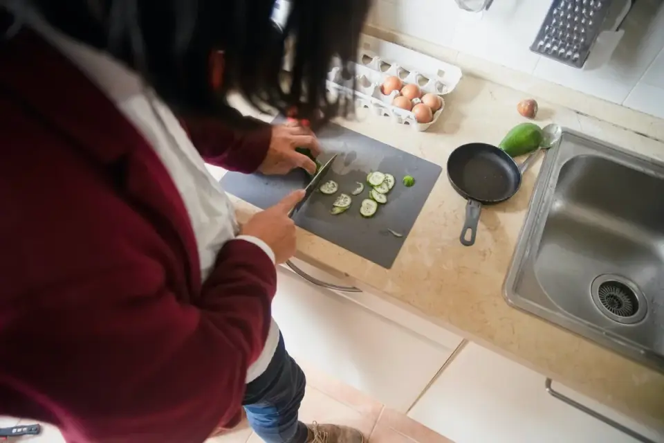 Dog owner preparing a meal